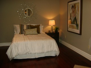 Bedroom with Wood Flooring - After