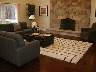 Living Area with Large Stone Fireplace After