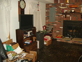 Large Living Room with Brick Fireplace Before