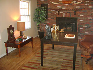 Large Living Room with Brick Fireplace After