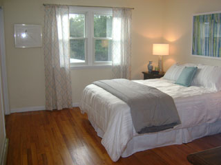 Bedroom with Wood Flooring and Windows - After