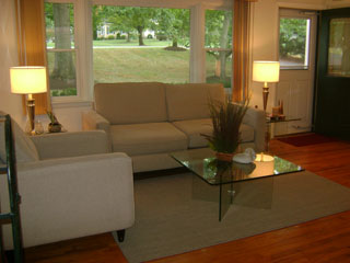 Living Room with Large Window and Front Door - After