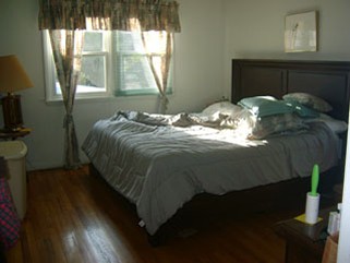 Bedroom with Wood Flooring and Windows - Before