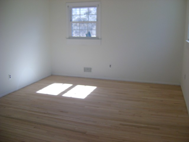 Empty Bed Room with White Painted Wall Side View - Before