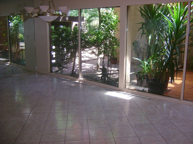 Empty Living Room with Glass Windows - Before